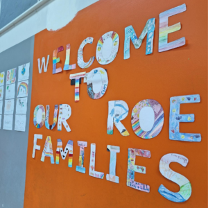 Welcome sign to our Roots of Empathy Families at the graduation day.